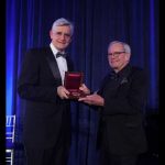 Dr. Bruce Stillman presenting the Double Helix Medal to Tom Brokaw.