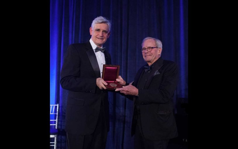 Dr. Bruce Stillman presenting the Double Helix Medal to Tom Brokaw.