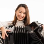 photo of Hanzhi Wang with accordion