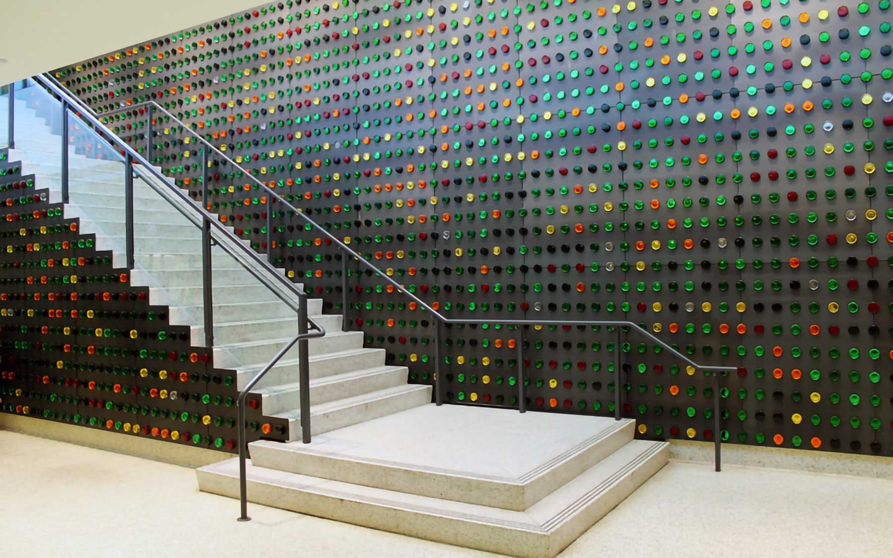 Manglano-Ovalle's Portrait of a Young Reader, flanking the Concourse level stair of the Bronx Library Center