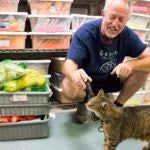 photo of Tim Mulligan with Sam the cat at Upland Farm