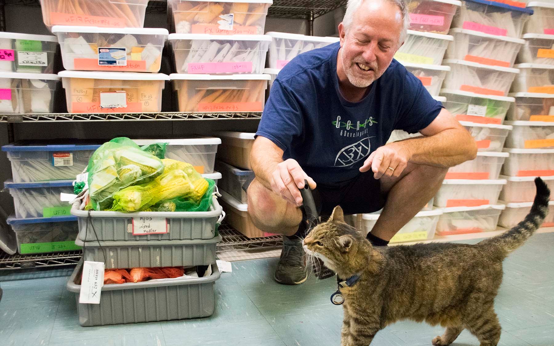 photo of Tim Mulligan with Sam the cat at Upland Farm