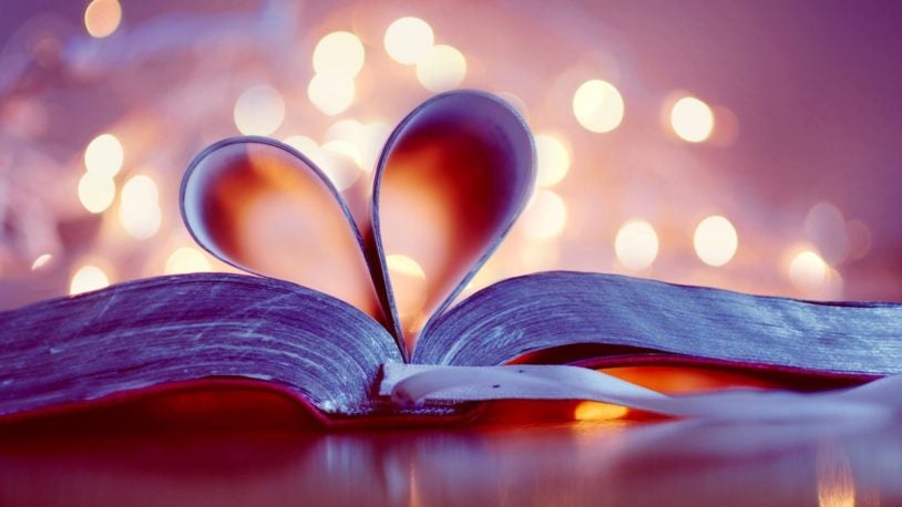 image of a book with pages curled into a heart