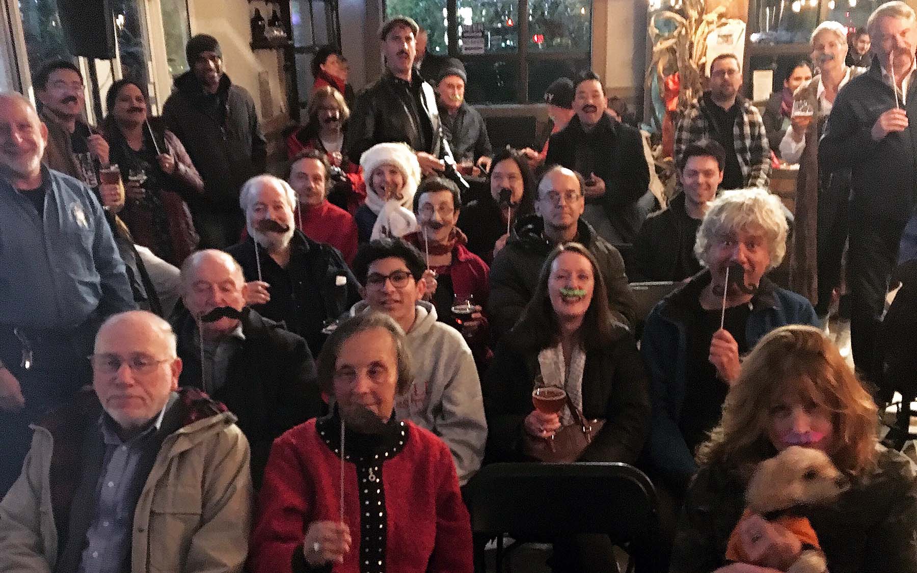 photo of crowd at Cocktails & Chromosomes Movember with moustaches
