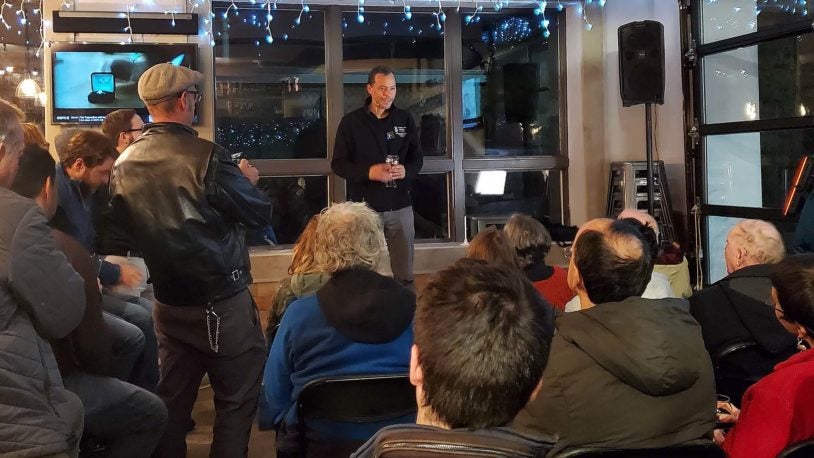 photo of Lloyd Trotman speaking to crowd for Cocktails & Chromosomes Movember