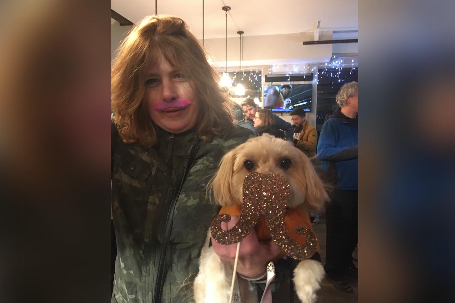 photo of Woman and her Dog sporting moustaches at Cocktails & Chromosomes Movember