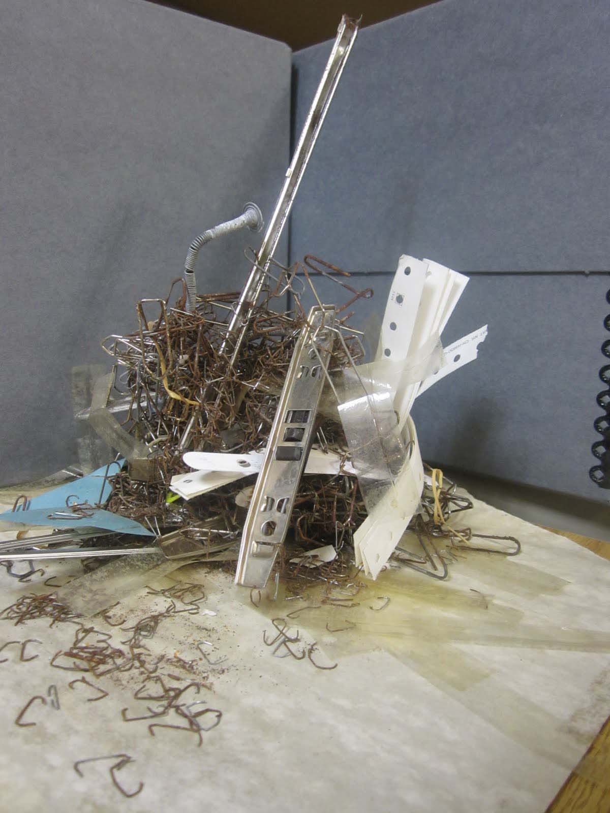 photo of Rusted fasteners and other material removed during processing