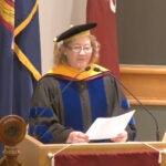 photo of Carol Greider behind podium during WSBS graduation 2017