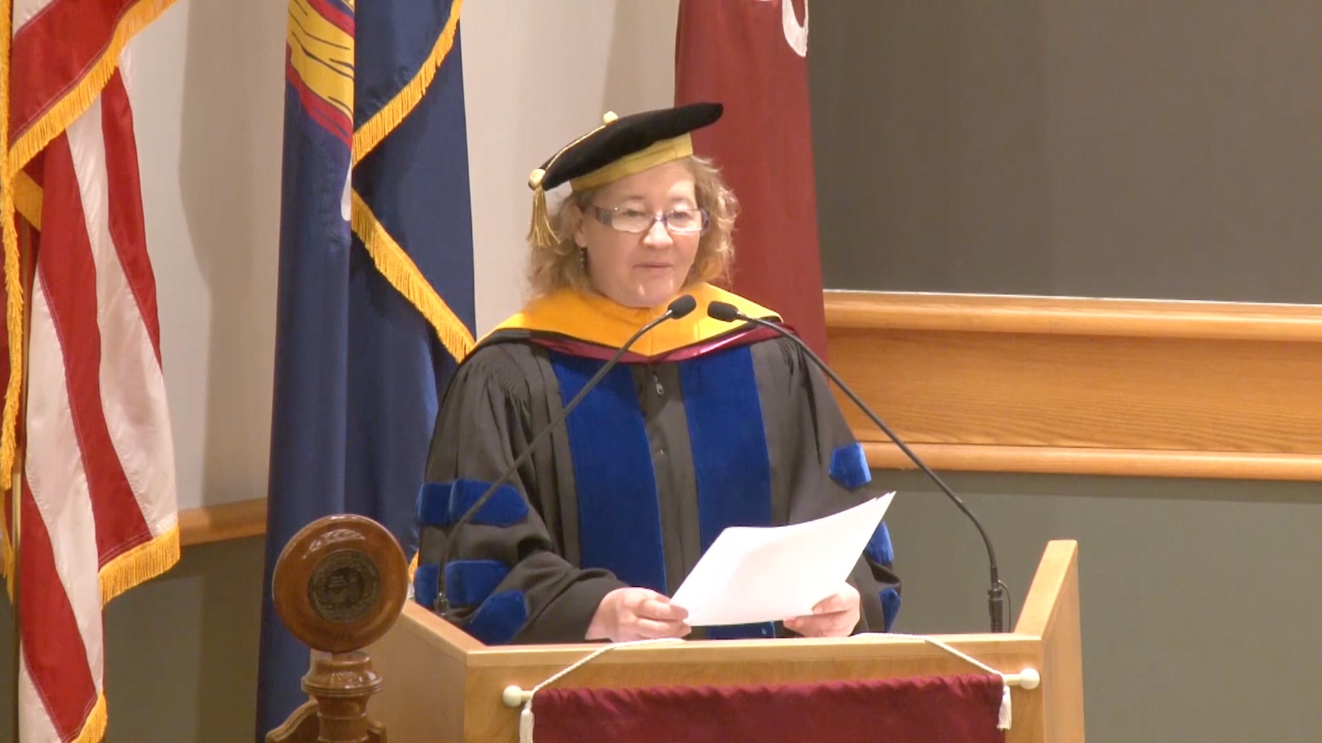 photo of Carol Greider behind podium during WSBS graduation 2017