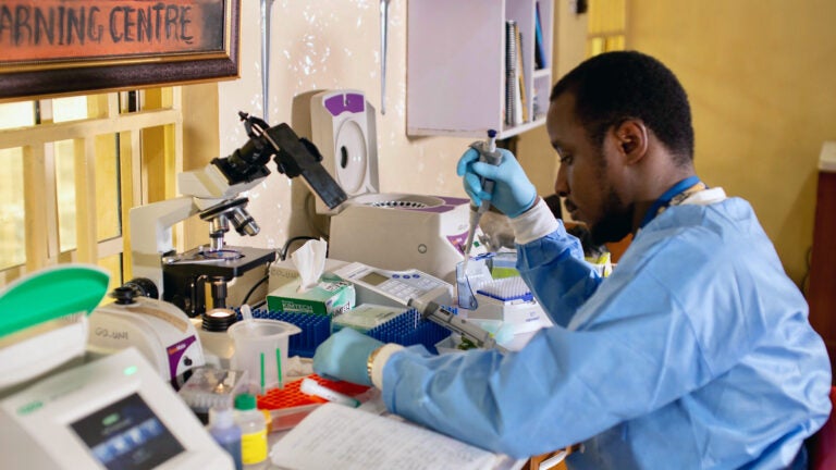 photo of Michael Okuru pipetting