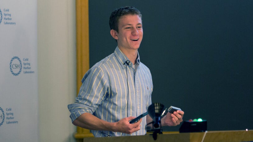 photo of Aspyn Palatnick_holding nanopore and iPhone