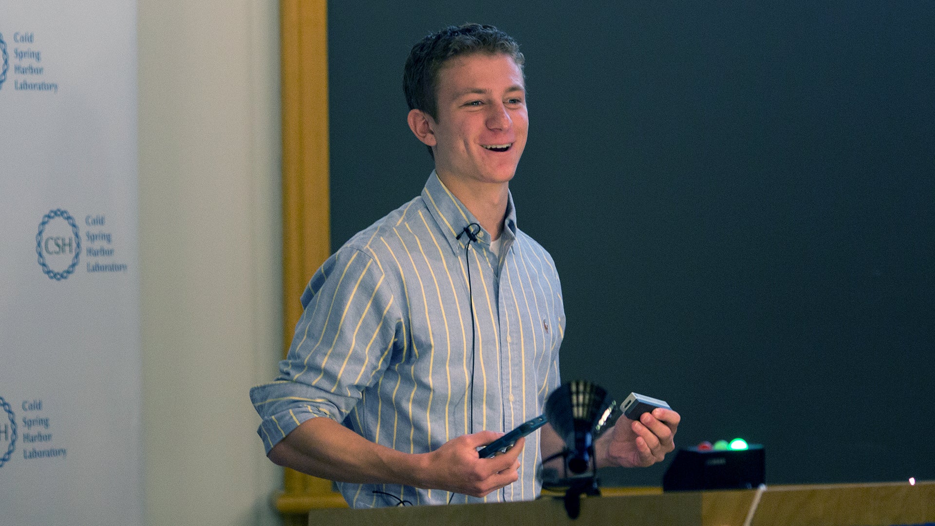 photo of Aspyn Palatnick_holding nanopore and iPhone