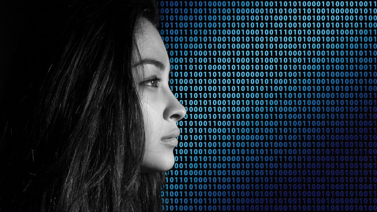 photo of woman in profile with binary code background