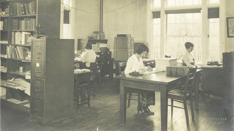 historic photo of people working in the Eugenics Records Office