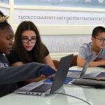 photo of students at the DNA Learning Center working on laptop computers
