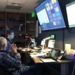 photo of the Meetings and Courses Program AV staff in control room