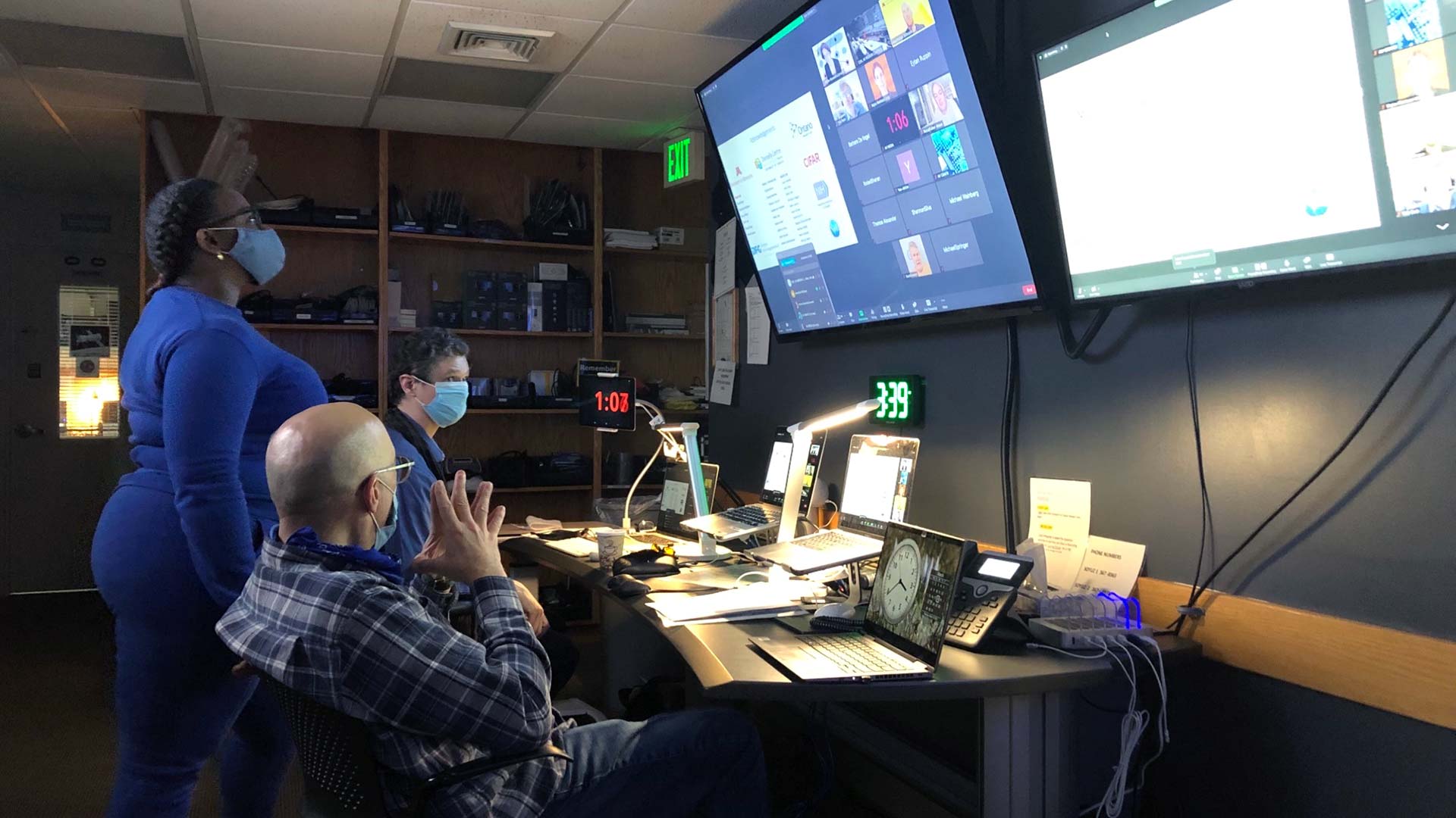 photo of the Meetings and Courses Program AV staff in control room