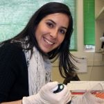 photo of Maria Luisa Pineda working in a lab