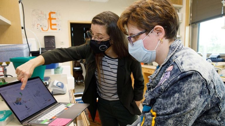 photo of Hannah Meyer working in her lab