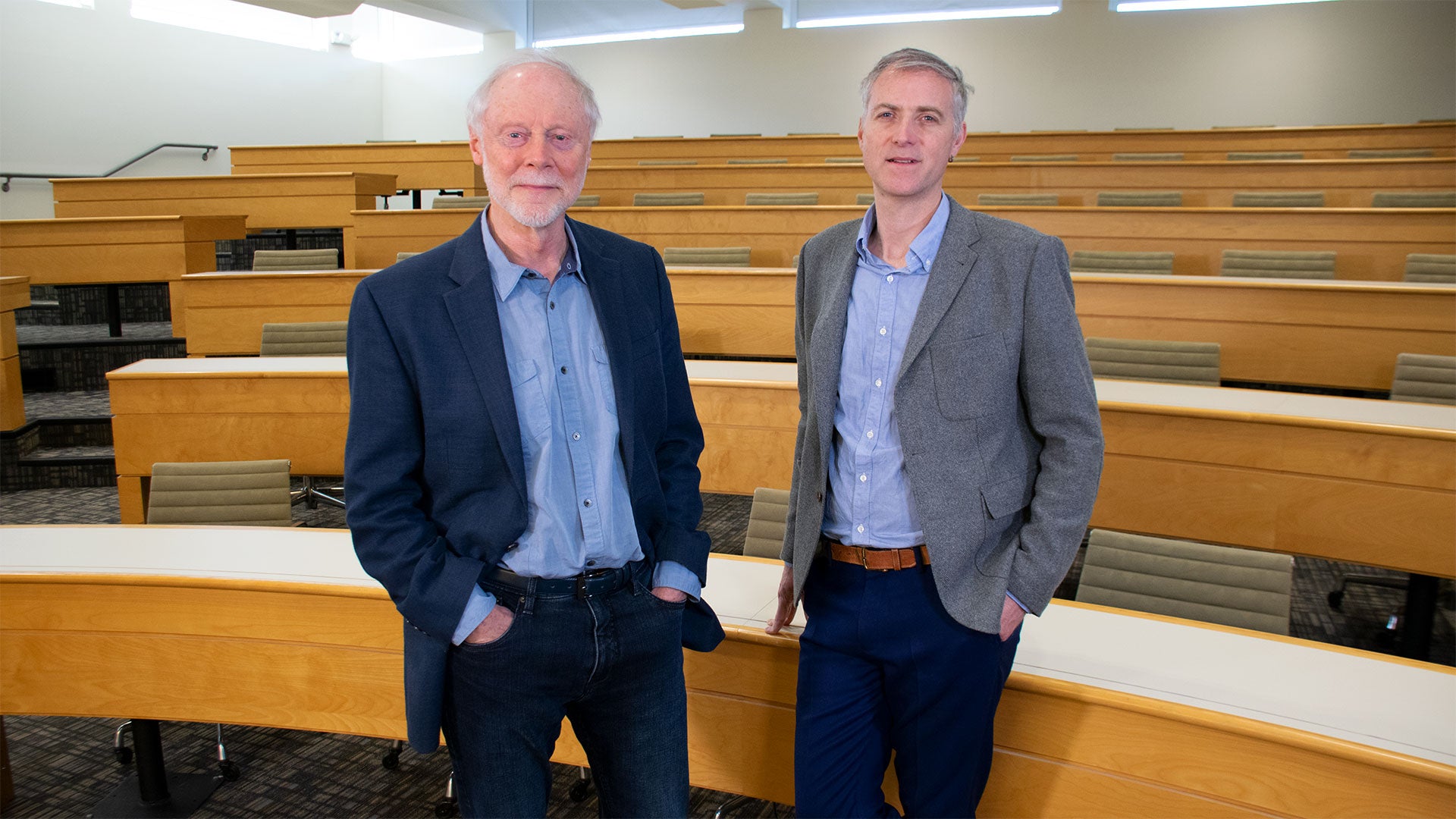 photo of John Inglis and Richard Sever in the CSHL Woodbury auditorium