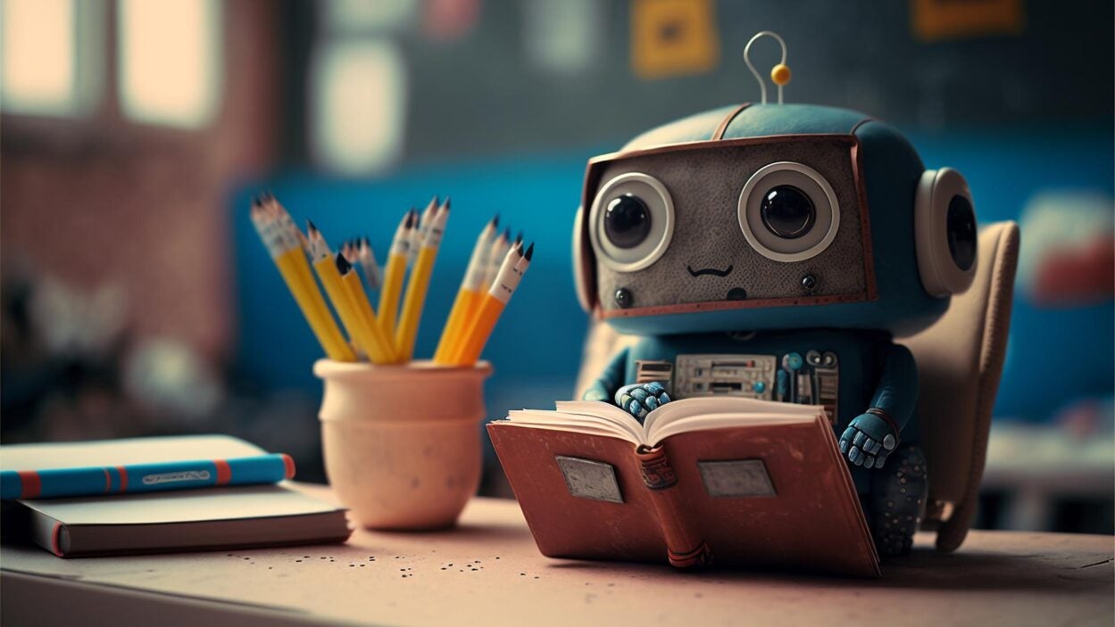 Image of a cute robot reading a book
