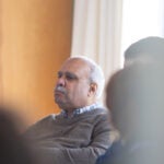 Georges Benjamin sitting in the conference room during the March 2024 "When No Response is Not an Option for Science" meeting.