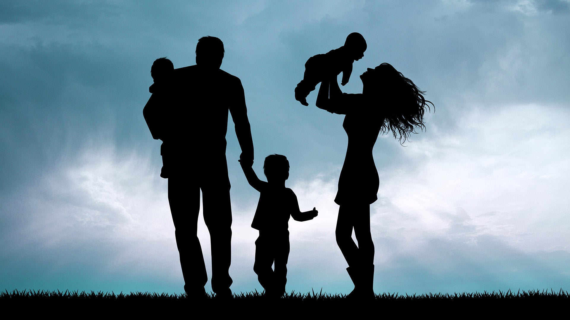 Image of a family silhouette at sunset