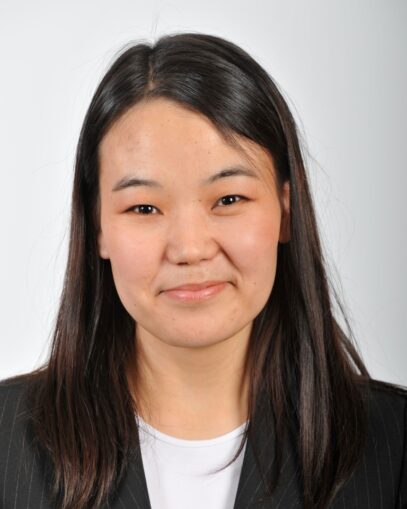 A photograph of Naranjargal Dashdorj smiling. She is wearing a black blazer and a white shirt.