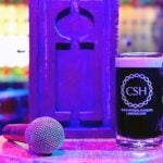 image of a microphone, a CSHL mug, and an Industry Makers logo on a bar stool