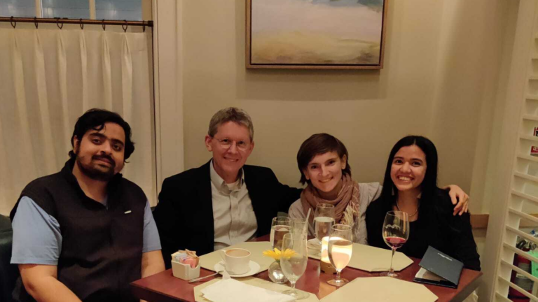Group photo of two DIAS officers and one CSHL Graduate Student with Dr. Michael Summers from UMBC.
