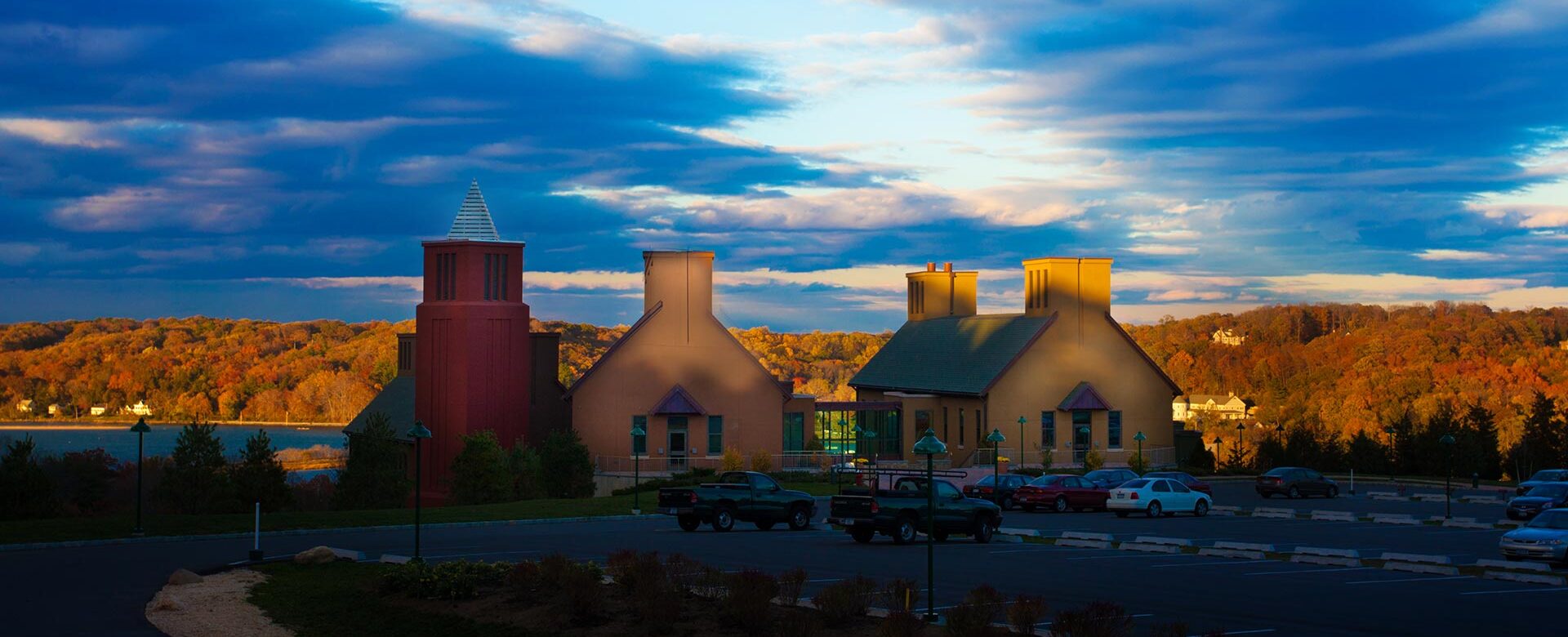 photo of the CSHL hillside campus with dramatic sunset sky