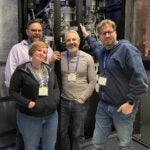 image of Cryo-EM Course instructors standing in front of the CSHL cryo-em microscope