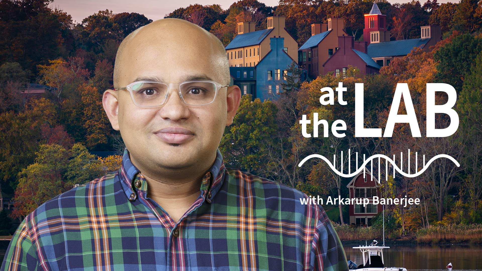 image of Cold Spring Harbor campus from across the harbor with At the Lab podcast logo and portrait of Arkarup Banerjee