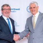 image of Michael Dowling and Bruce Stillman shaking hands