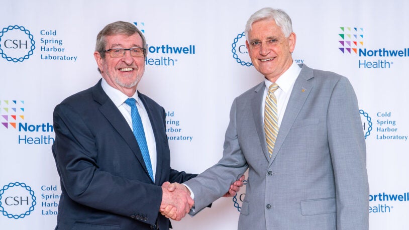 image of Michael Dowling and Bruce Stillman shaking hands