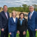 image of Kevin Law, Marilyn Simons, Kathy Hochul, and Bruce Stillman touring the CSHL expansion project