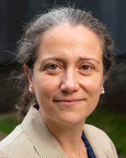 Alessandra Luchini smiling. She is wearing a beige blazer.