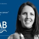 image of At the Lab podcast with black and white portrait of Claudia Tonelli on a blue background