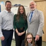 Image of Adrian Krainer with the Larson family at the lab
