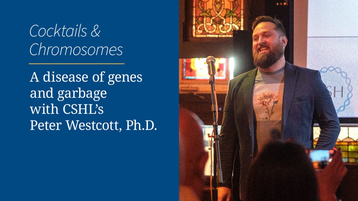Peter Westcott smiles at a microphone during a Cocktails & Chromosomes science event at CSHL.