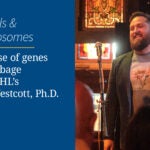 Peter Westcott smiles at a microphone during a Cocktails & Chromosomes science event at CSHL.